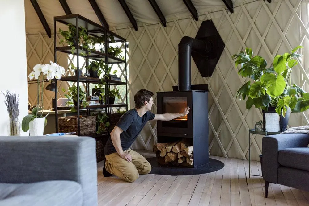 a raise q tee ii wood burning stove keeps the yurt cozy